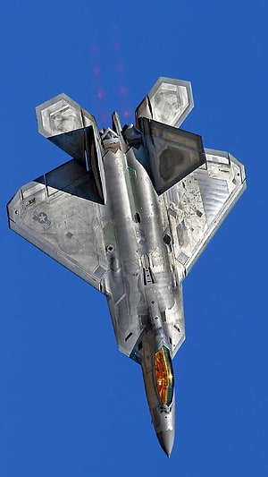 F-22 Raptor Stealth Fighter Jet Banking Through Clear Blue Sky HD phone wallpaper
