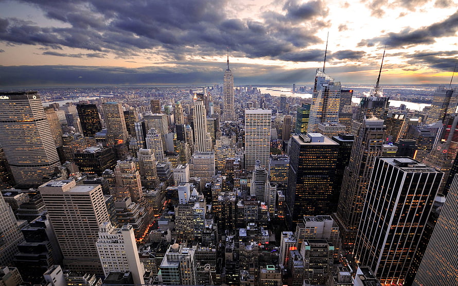 Aerial View of New York City Skyline at Dusk with Dramatic Clouds HD wallpaper