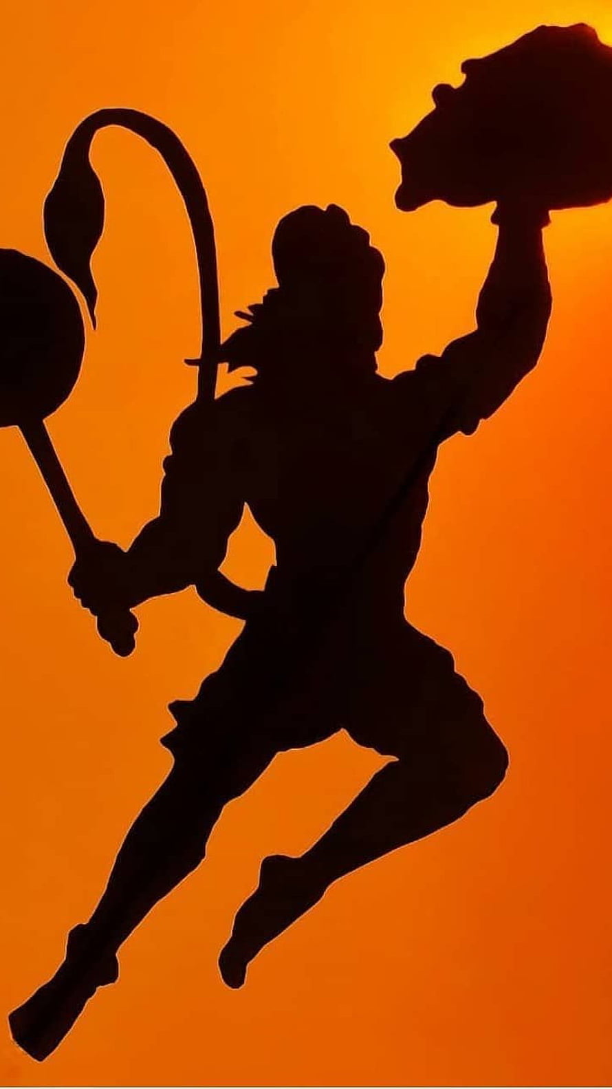 Silhouette of Sun Wukong the Monkey King wielding staff against orange sunset background HD phone wallpaper