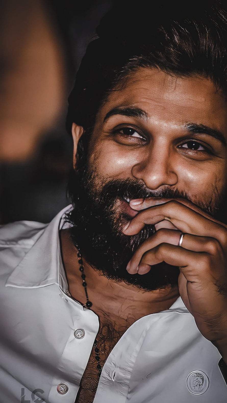 Allu Arjun Close-Up Portrait in White Shirt with Beaded Necklace HD phone wallpaper