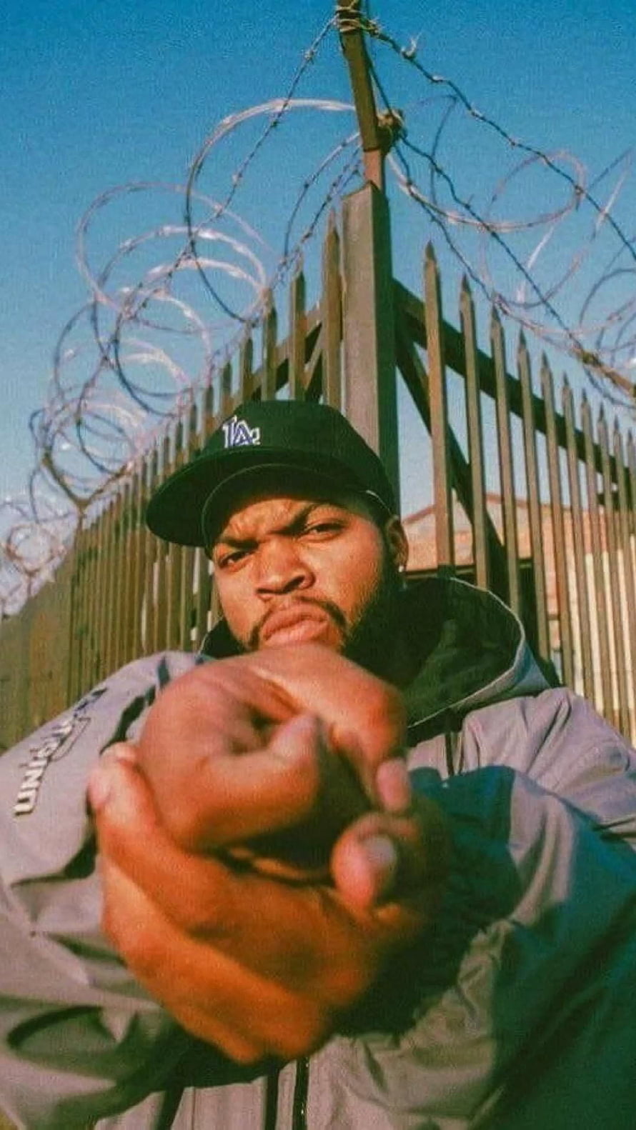 Ice Cube Intense Portrait With Barbed Wire Fence Background HD phone wallpaper