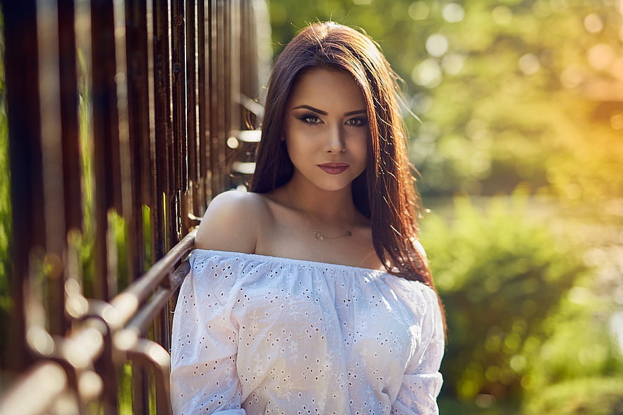 Young woman in white off-shoulder top leaning against wooden fence in golden hour light, Unknown Model, babe, lady, model, woman HD wallpaper