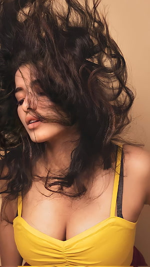 Kethika Sharma Portrait With Flowing Dark Hair And Yellow Top HD phone wallpaper