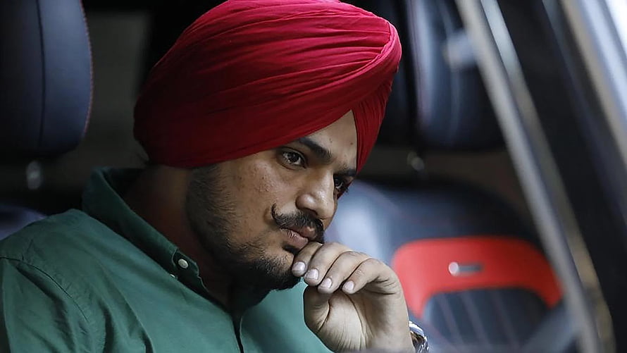 Sidhu Moose Wala in Red Turban and Green Shirt with Thoughtful Expression HD wallpaper