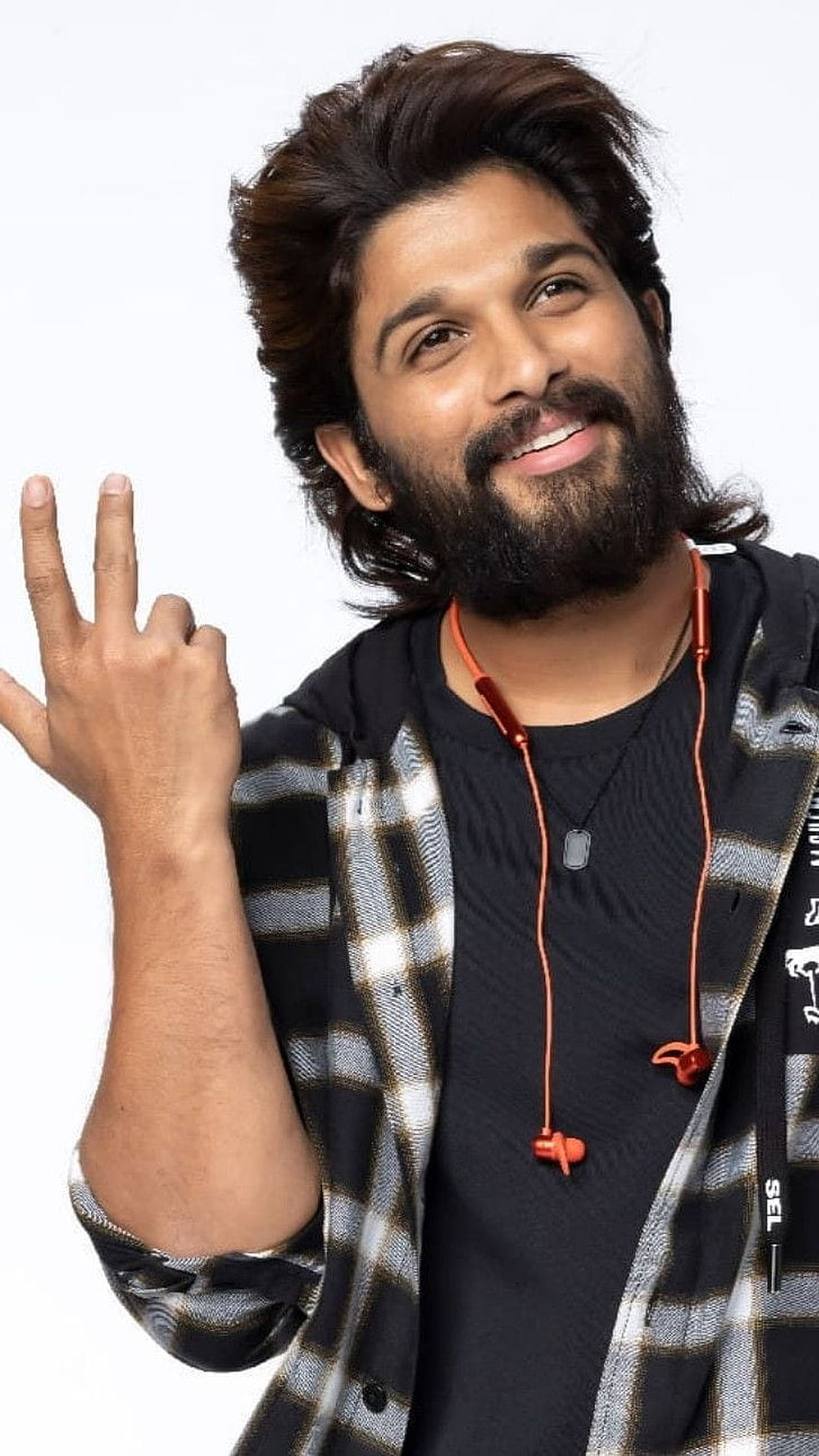 Allu Arjun smiling portrait with red earphones and plaid shirt HD phone wallpaper