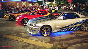 Nissan Skyline R34 GT-R with Blue Underglow at Night Car Meet HD wallpaper