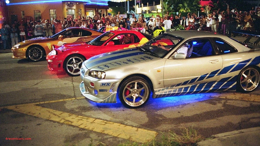Nissan Skyline R34 GT-R with Blue Underglow at Night Car Meet HD wallpaper