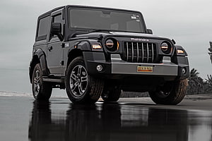 Mahindra Thar Black Edition Off-Road SUV on Wet Beach HD wallpaper