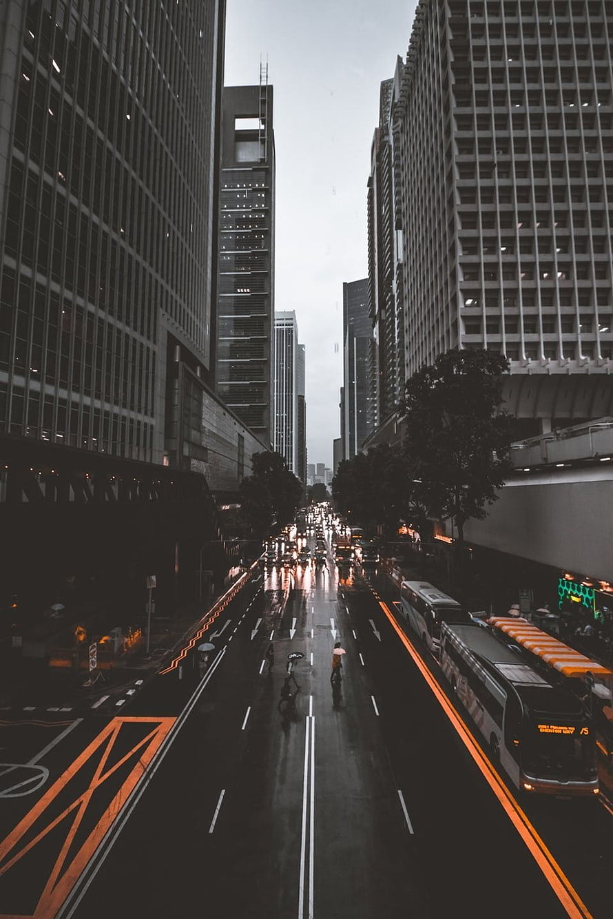 Moody Urban Street View With Wet Asphalt And Towering Skyscrapers HD phone wallpaper