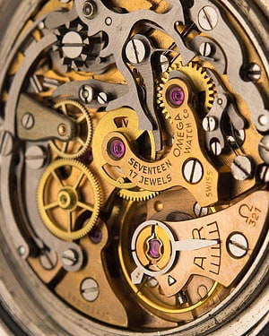 Omega Watch Movement Macro: Intricate Gears, Jewels, and Swiss Mechanical Engineering HD phone wallpaper