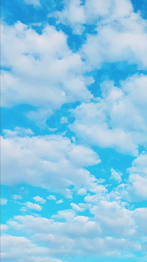 Serene Blue Sky with Fluffy White Clouds for a Peaceful Desktop Background HD phone wallpaper