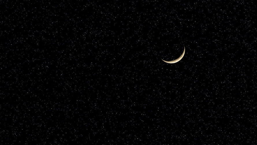 Crescent Moon Glowing in a Starry Night Sky HD wallpaper