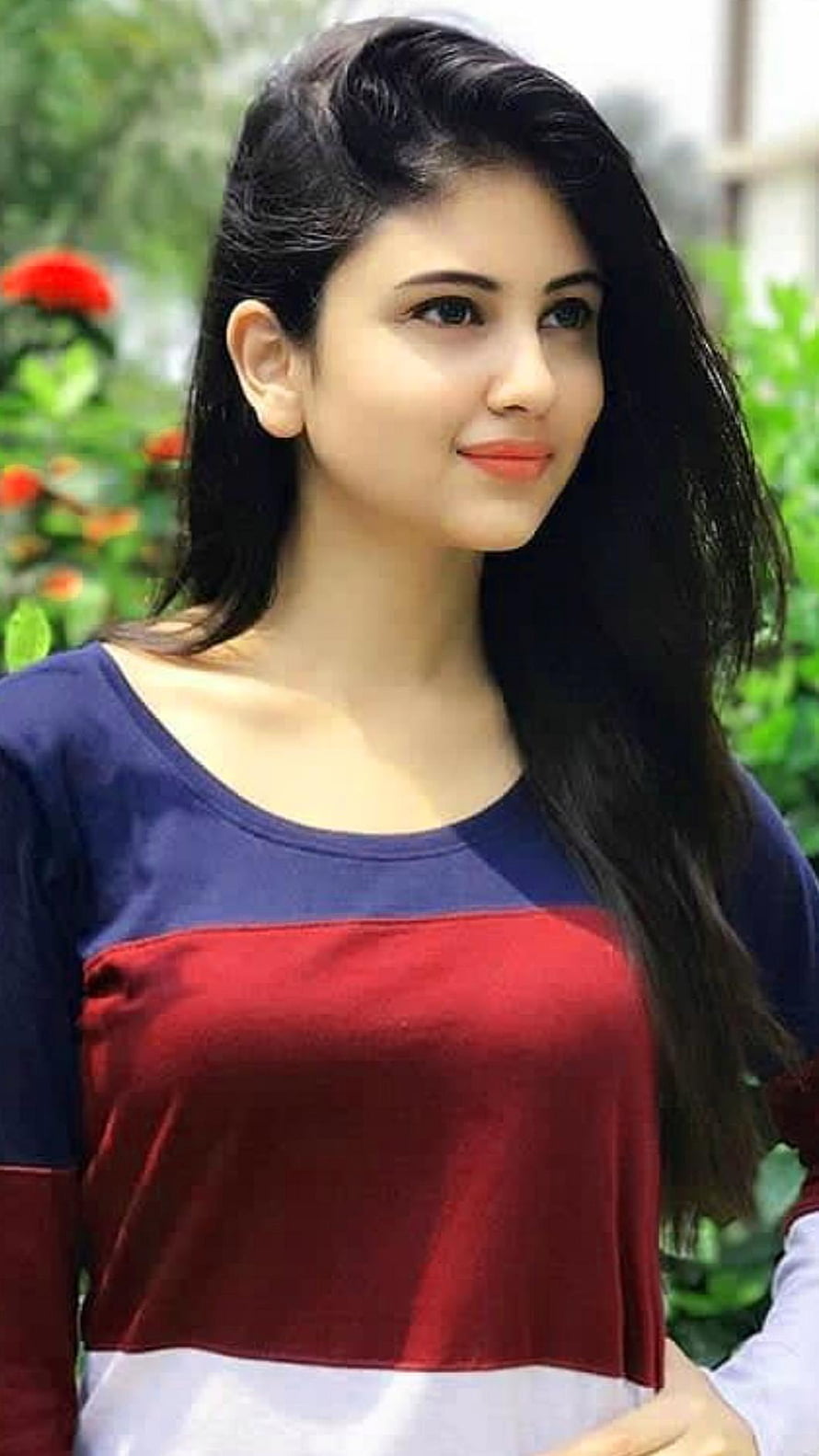 Adah Sharma in a Colorful Top with a Garden Background HD phone wallpaper