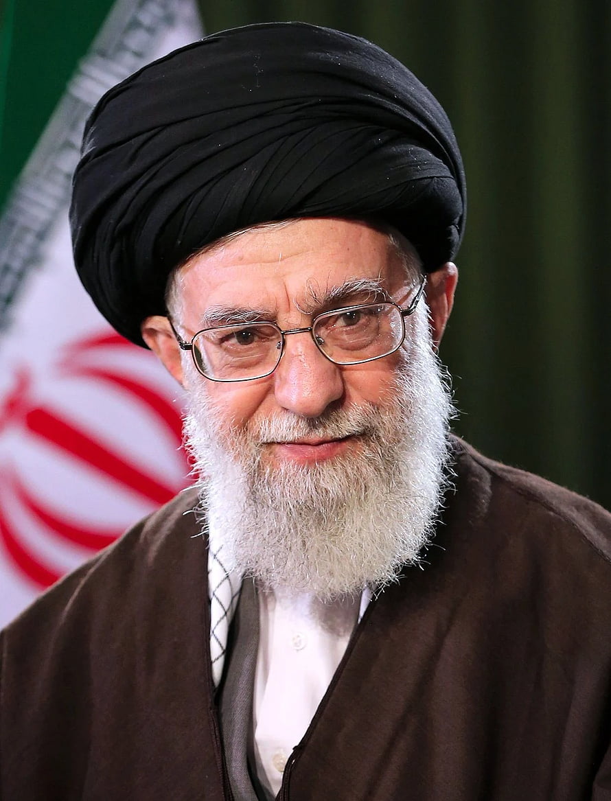 Portrait of Ali Khamenei Wearing Black Turban and Glasses in Front of Iranian Flag HD phone wallpaper