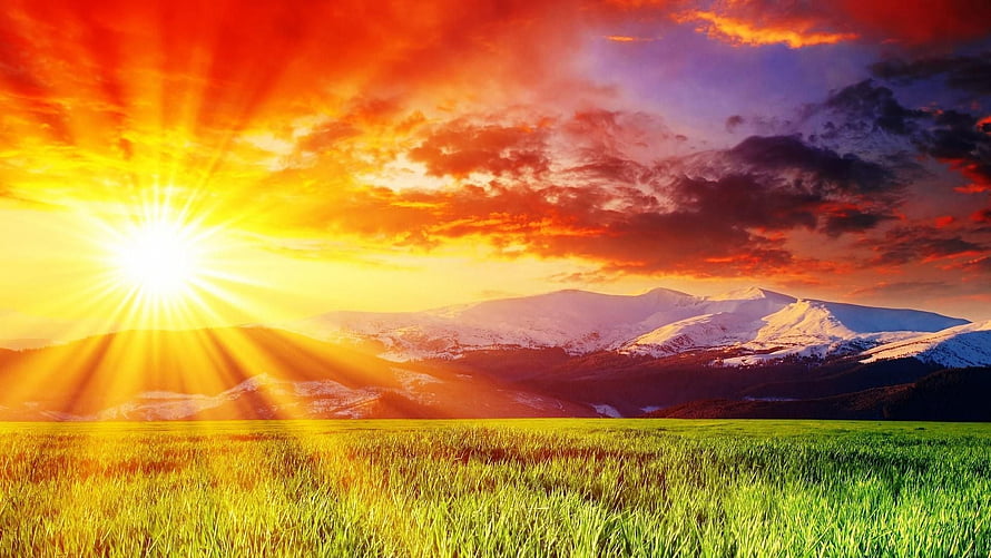 Vibrant Sunrise Over Snow-Capped Mountains and Green Meadow HD wallpaper