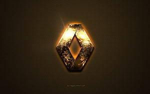 Glowing Golden Renault Emblem on Dark Textured Metal Surface HD wallpaper