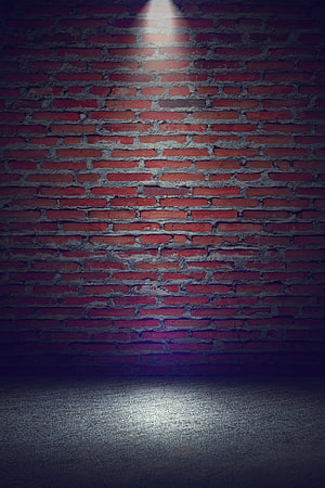Dark Red Brick Wall Background With Spotlight On Concrete Floor HD phone wallpaper