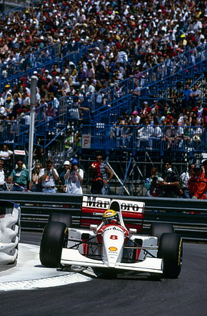 Ayrton Senna in the 1994 McLaren MP4/9 Formula One car on the race track HD phone wallpaper