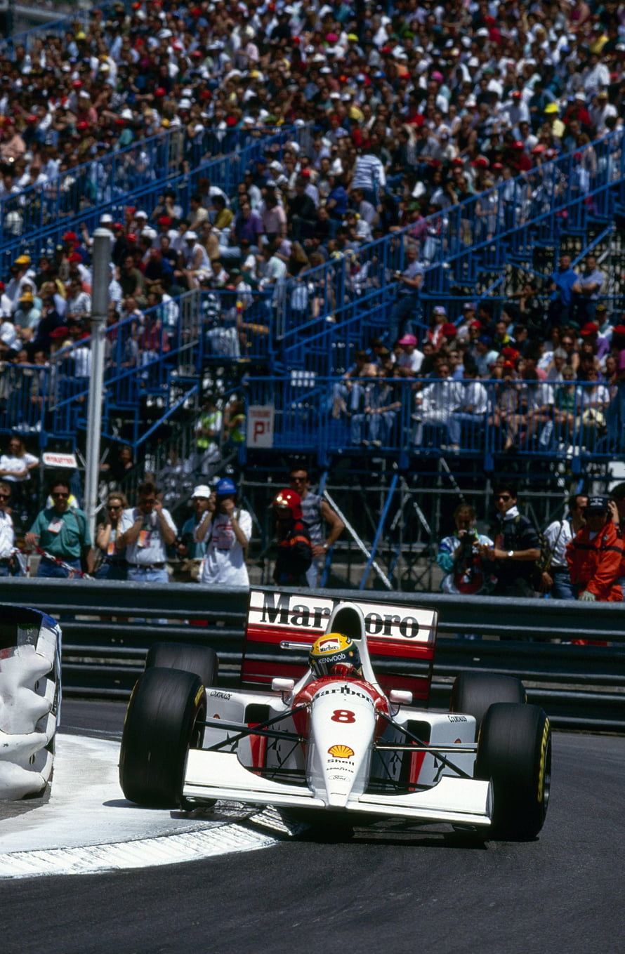 Ayrton Senna in the 1994 McLaren MP4/9 Formula One car on the race track HD phone wallpaper