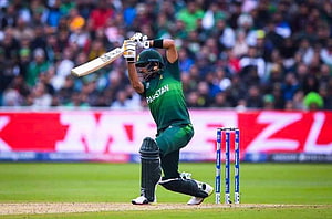 Babar Azam in Pakistan Green Kit Playing a Powerful Cricket Shot at the Stumps HD wallpaper