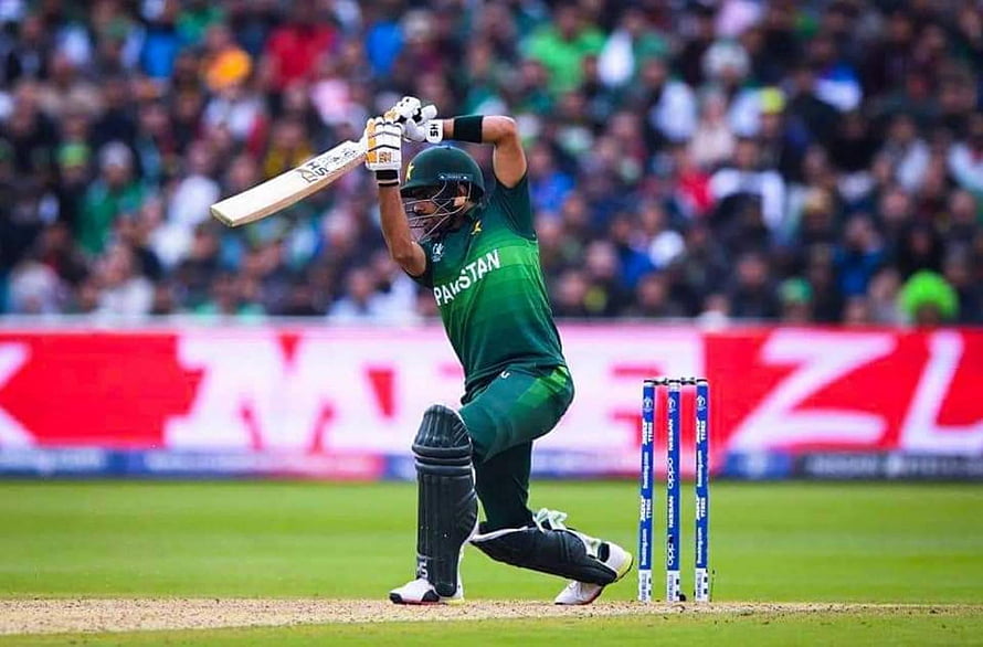 Babar Azam in Pakistan Green Kit Playing a Powerful Cricket Shot at the Stumps HD wallpaper