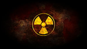 Glowing Yellow Radiation Symbol on Dark Grunge Background HD wallpaper