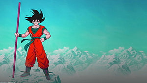 Goku Standing on Rocky Outcrop with Nimbus Staff Against Snowy Mountain Range HD wallpaper