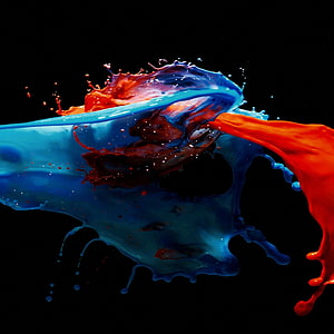 Vibrant Blue and Red Paint Splash Colliding on Black Background HD phone wallpaper