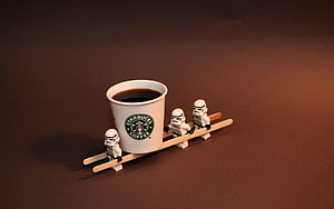 Starbucks Coffee Cup Carried by Star Wars Stormtrooper Minifigures on Wooden Skis HD wallpaper