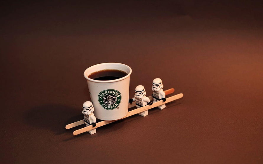 Starbucks Coffee Cup Carried by Star Wars Stormtrooper Minifigures on Wooden Skis HD wallpaper