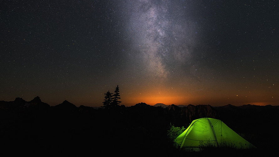 Glowing Green Tent Under the Milky Way in a Mountainous Night Landscape HD wallpaper