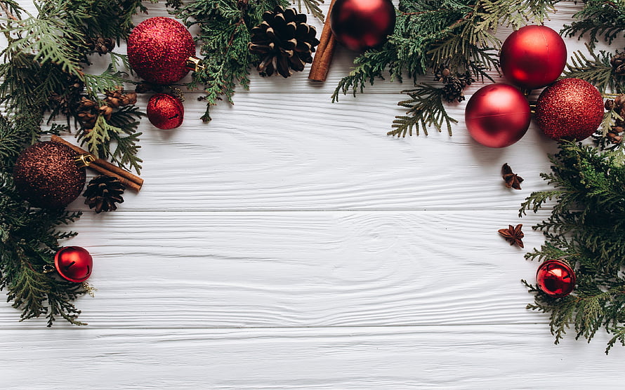 Festive Christmas Border With Red Baubles, Pine Branches, and Spices on White Wood HD wallpaper