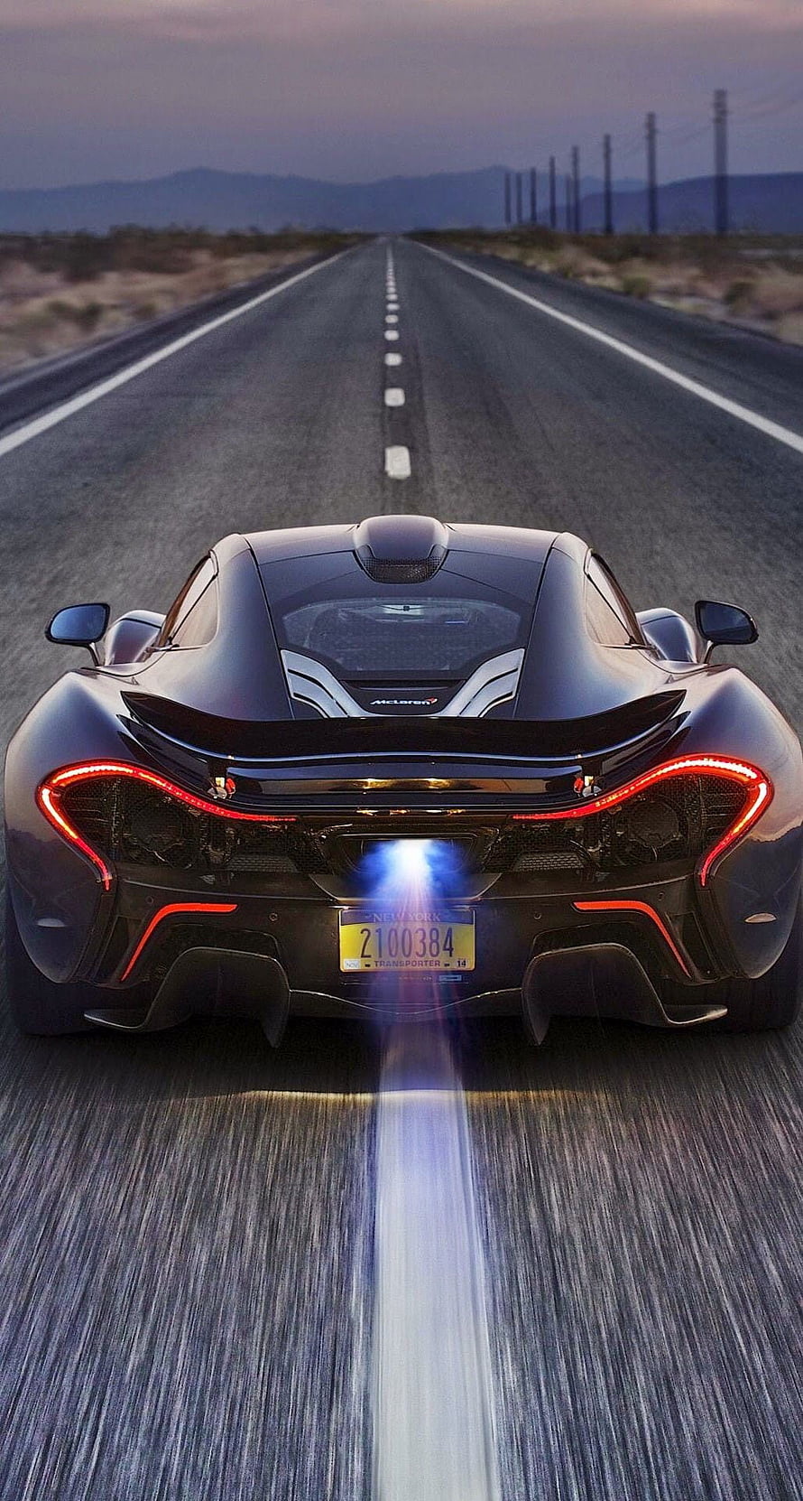 McLaren P1 Rear View on Desert Highway at Dusk with Motion Blur HD phone wallpaper