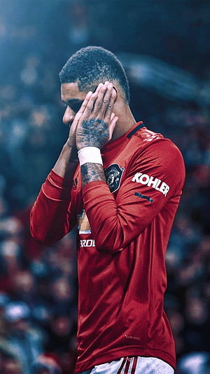 Marcus Rashford in Manchester United Red Kit Covering Face on the Pitch HD phone wallpaper