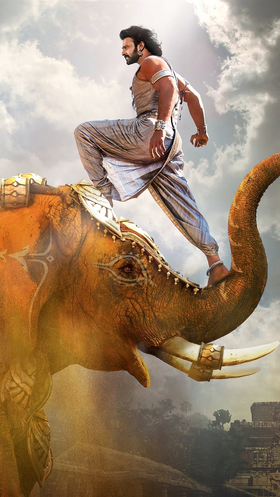 Prabhas as Baahubali standing on a war elephant in an epic cinematic scene HD phone wallpaper