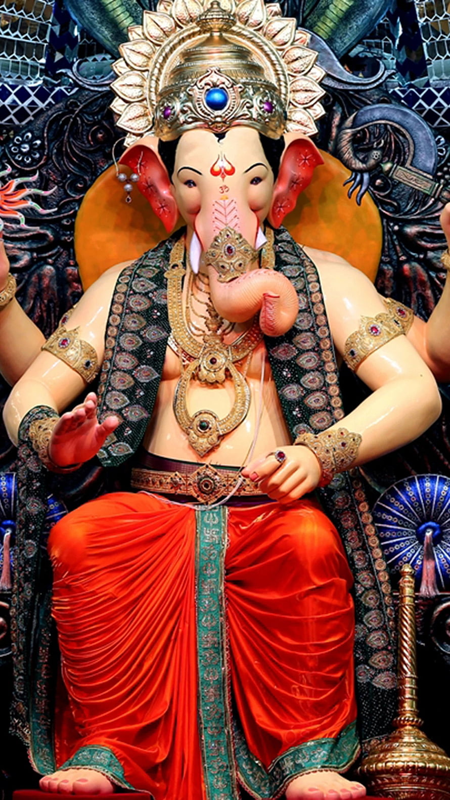 Ganesha Statue in Red Silk and Gold Jewelry HD phone wallpaper