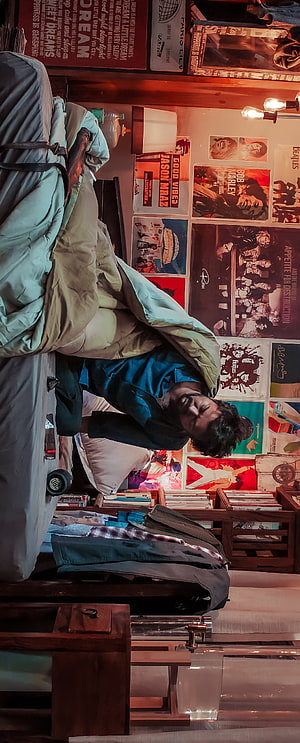 Man Sleeping in Cozy Bedroom with Vintage Music Posters and Warm Lighting, Master, city, thalapathy, vijay thalapathy, vijay HD phone wallpaper