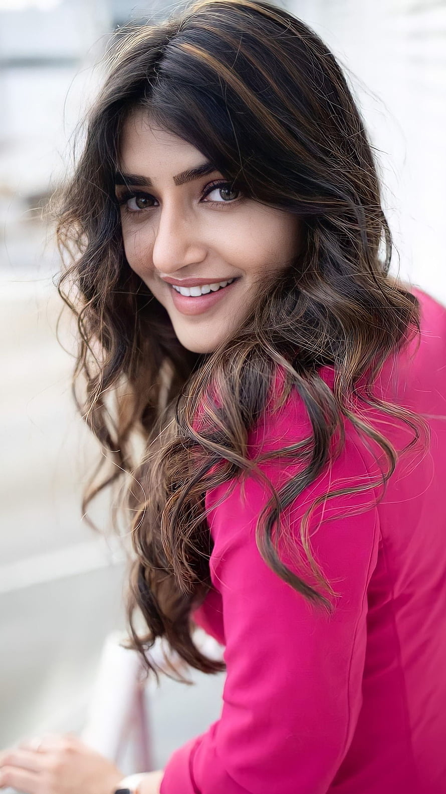 Pooja Hegde smiling portrait in a vibrant pink top with wavy brown hair HD phone wallpaper