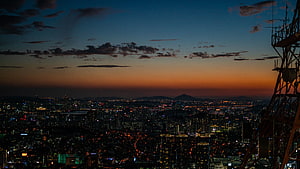 Seoul Cityscape at Dusk with Towering Skyline and Glowing Urban Lights HD wallpaper