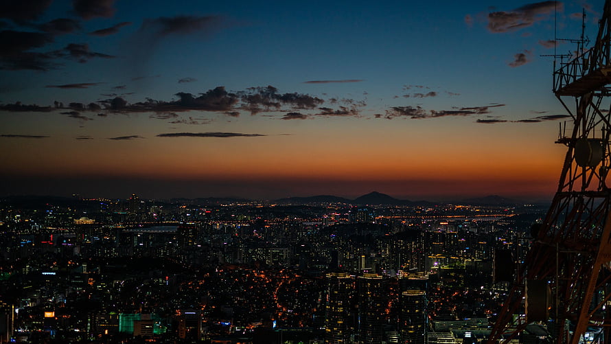 Seoul Cityscape at Dusk with Towering Skyline and Glowing Urban Lights HD wallpaper