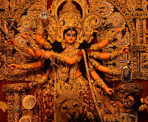 Ornate Golden Durga Ma Idol with Lion and Demon Slayer for Durga Puja Festival HD wallpaper