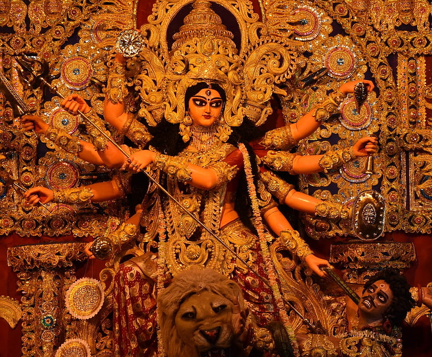 Ornate Golden Durga Ma Idol with Lion and Demon Slayer for Durga Puja Festival HD wallpaper
