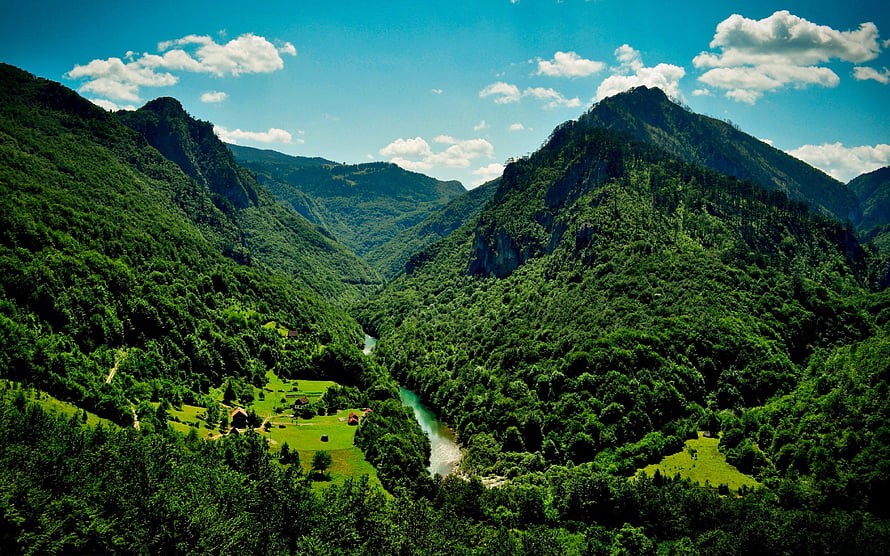 Lush Green Mountain Valley With Winding River And Blue Sky HD wallpaper