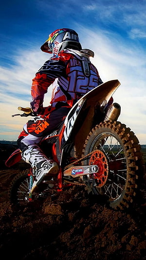 Motocross Rider on KTM Dirt Bike in Action on Muddy Terrain HD phone wallpaper