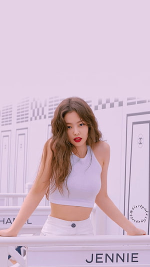 Jennie Kim in White Crop Top and Jeans Against a Minimalist Backdrop HD phone wallpaper