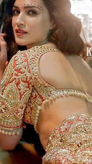 Parineeti Chopra in a stunning red and gold embroidered lehenga with intricate back detailing and traditional jewelry HD phone wallpaper