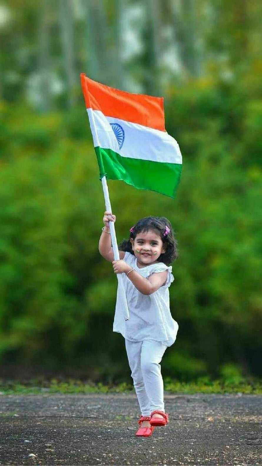 Cute Little Girl Holding Indian Flag With Face Paint In White Outfit HD phone wallpaper