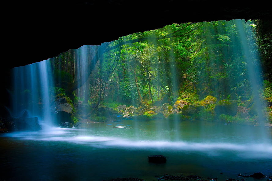 Mystical Waterfall in Lush Forest with Sunbeams HD wallpaper