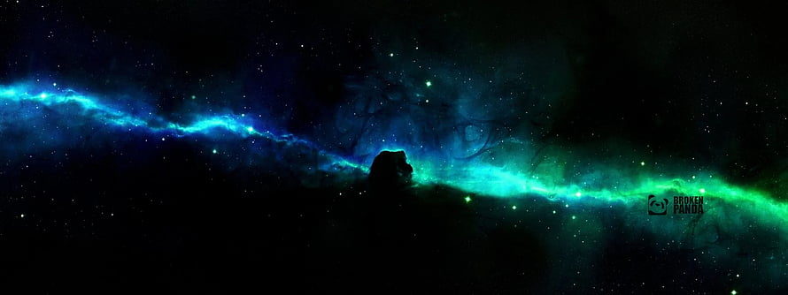 Vibrant Blue and Green Nebula Spanning a Dark Dual Monitor Space Scene HD wallpaper