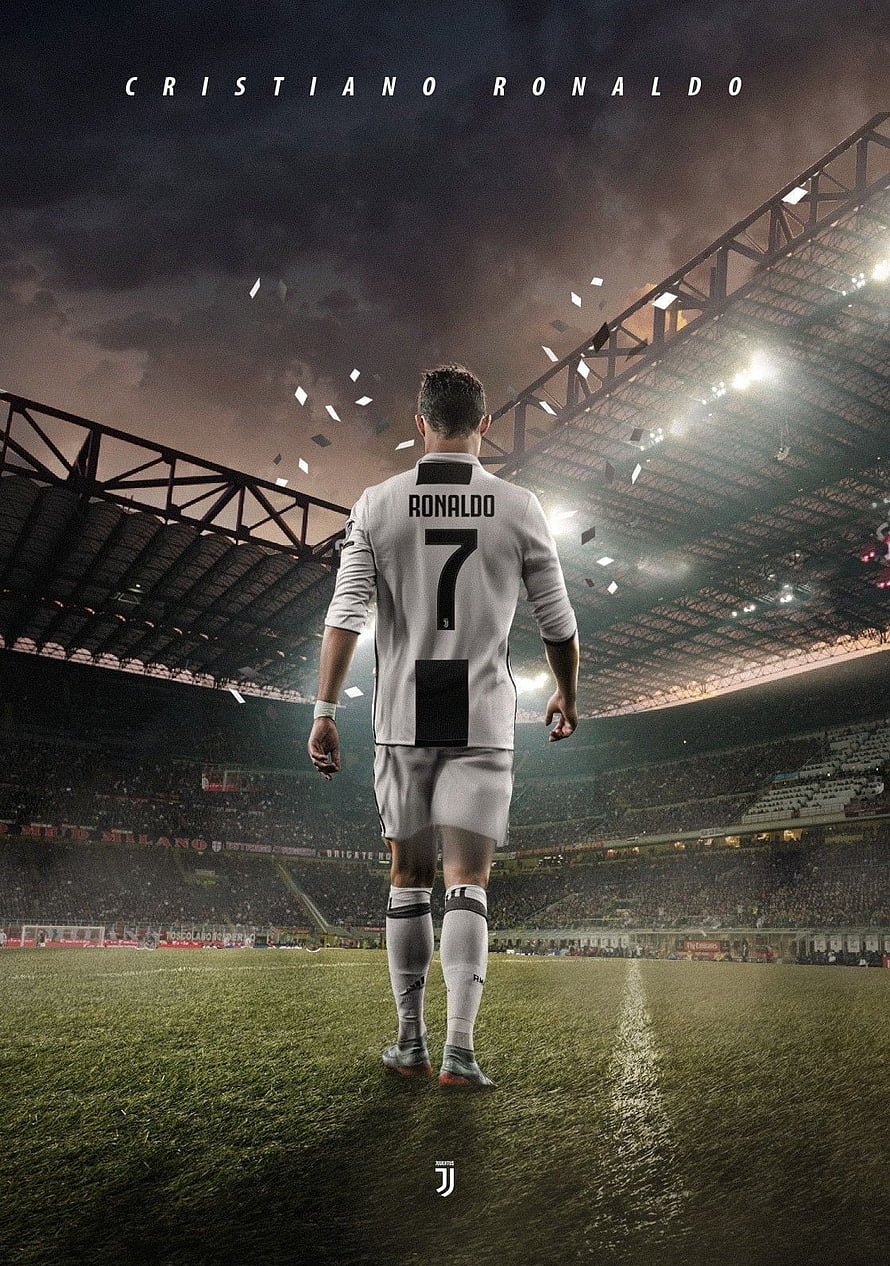 Cristiano Ronaldo in Juventus Kit Walking on the Pitch Under Stadium Lights HD phone wallpaper